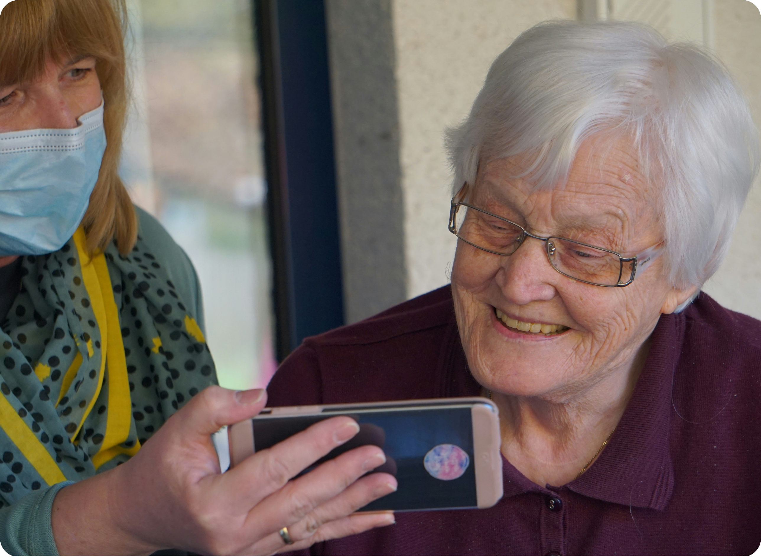 Elderly woman using phone